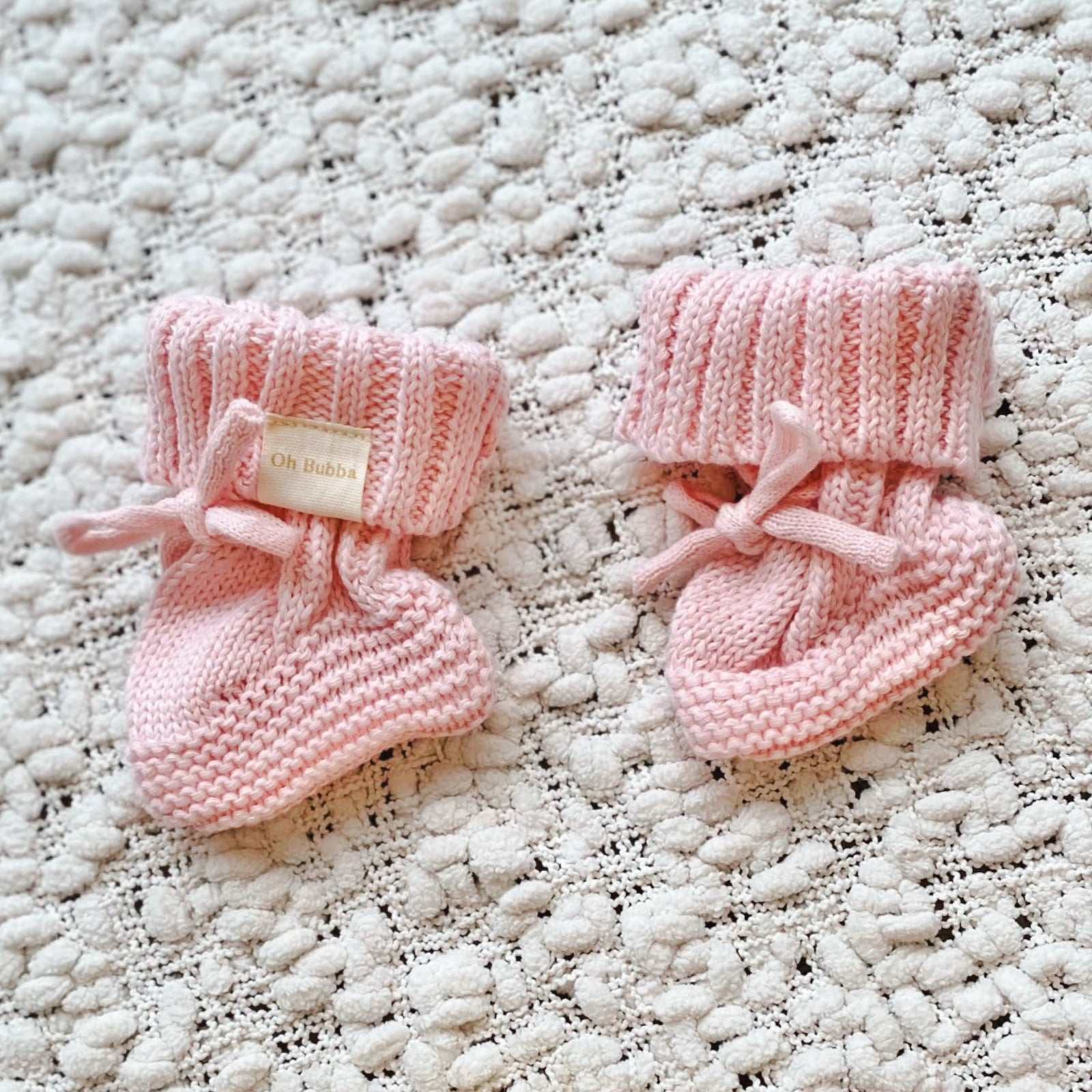Pink knit baby booties. Newborn knit booties