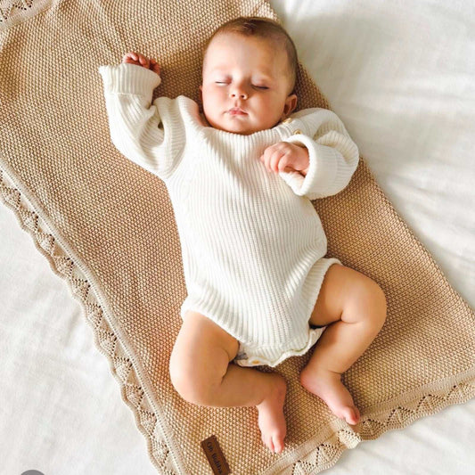 Chunky knit baby knit romper. White knit baby knit romper. Baby boy knit clothing