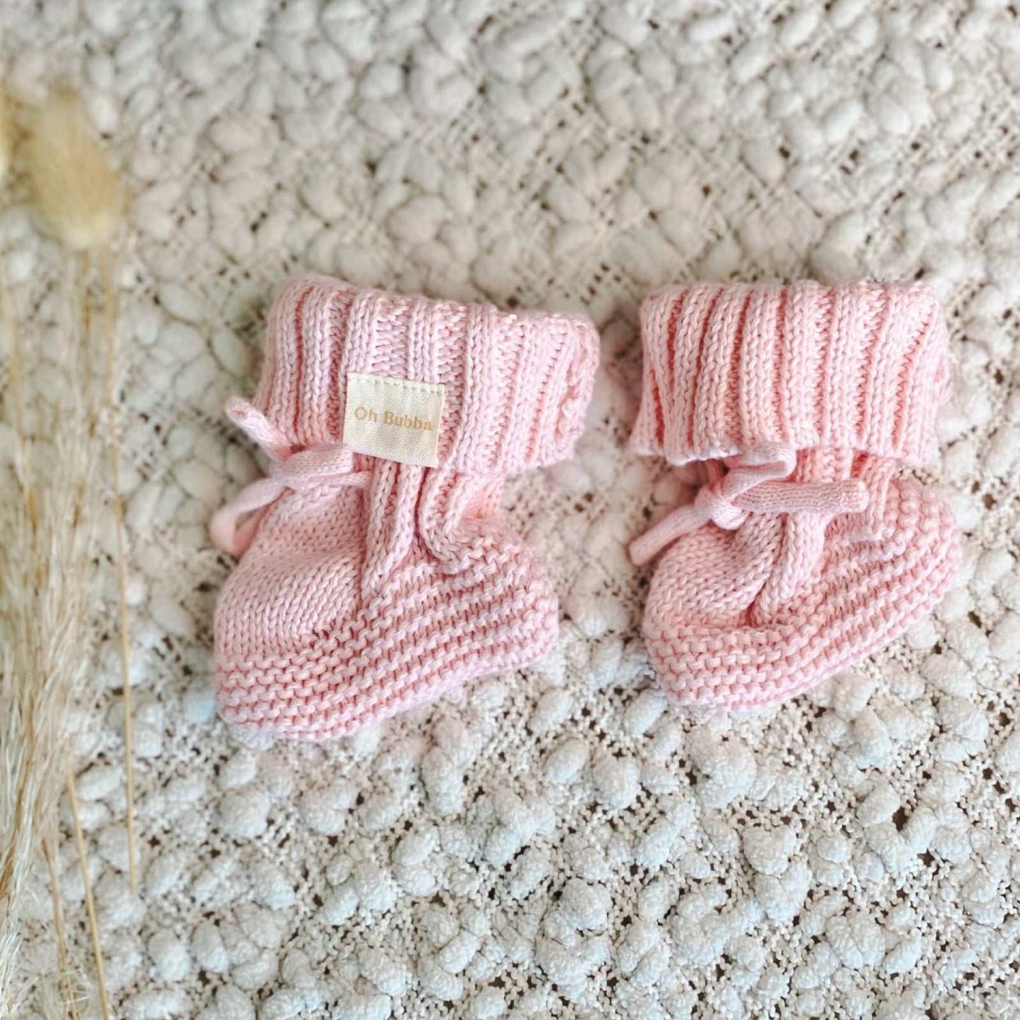Pink knit baby booties. Newborn baby booties 