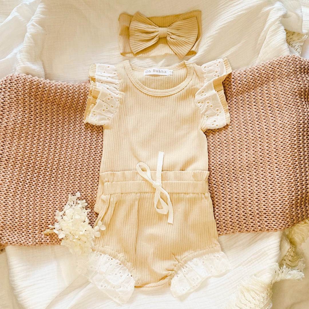 Beige baby girl clothing set. Baby girl romper, bloomer and headband set